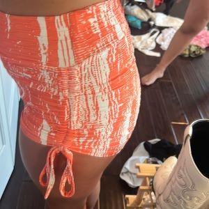 Orange and white pattered synch high waisted booty shorts
